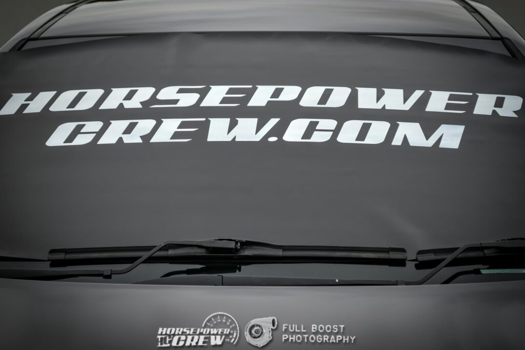 windscreen cover dot com modern size black with white writing close up